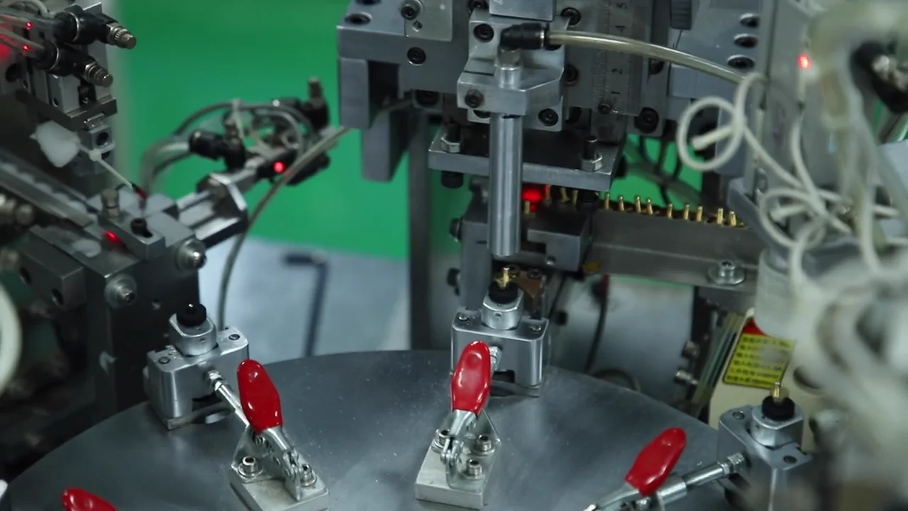 Automated rotary assembly fixture operating inside the AIMEI production facility.