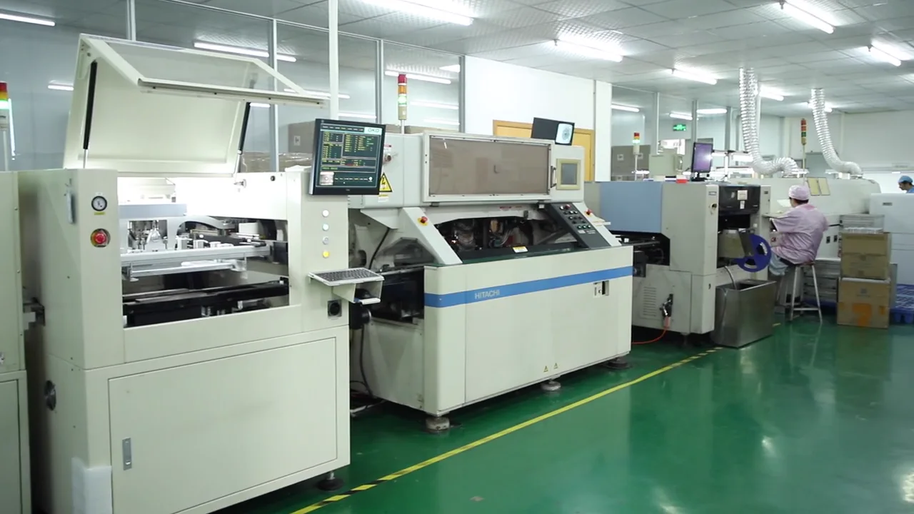 PCB manufacturing equipment operating inside AIMEI's electronics production area.